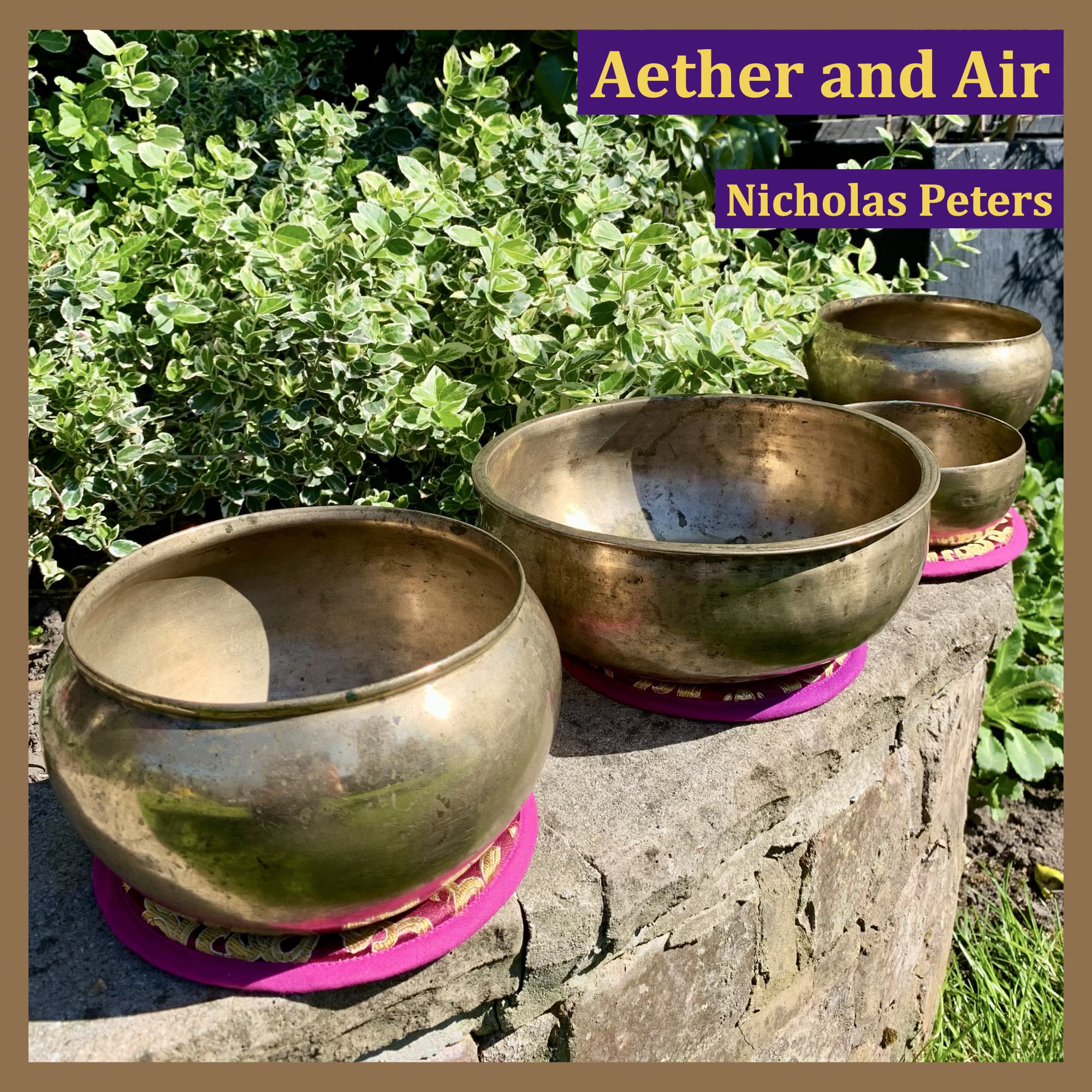 Single artwork with text that reads: “Aether and Air by Nicholas Peters". The photograph in the artwork shows four antique Himalayan singing bowls resting on brocade cushion pads on a brick wall in the garden, surrounded by green foliage. The bowls in the photograph are a Dolpo Tantric bowl (front left), a Tantric Shaman bowl (centre), a Thadobati cup bowl (to the right of the Tantrik Shaman bowl), and a Dolpo Tantric bowl (back right).